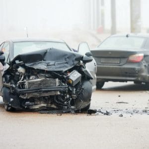 Two cars involved in a Car Accident. One cars front bumper is severely damaged. Case taken on by New Orleans Car Accident Lawyer - Cueria Law Firm